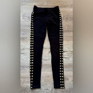 Black leggings Size S featuring gold-colored square pyramid studs running down